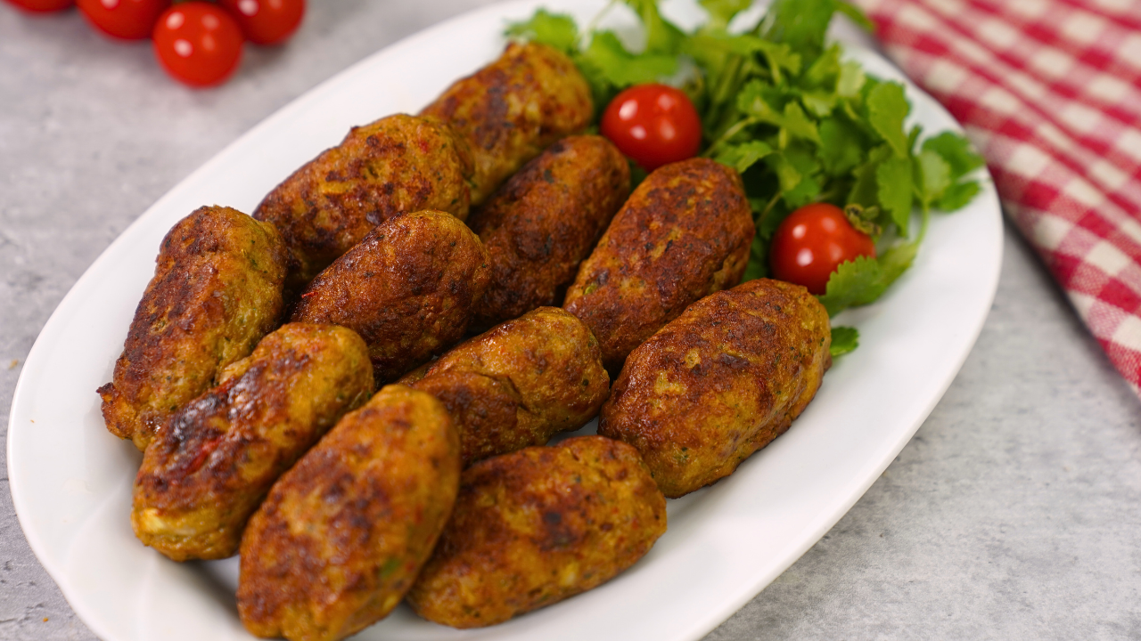 Muthi kababs served on a plate with mint chutney