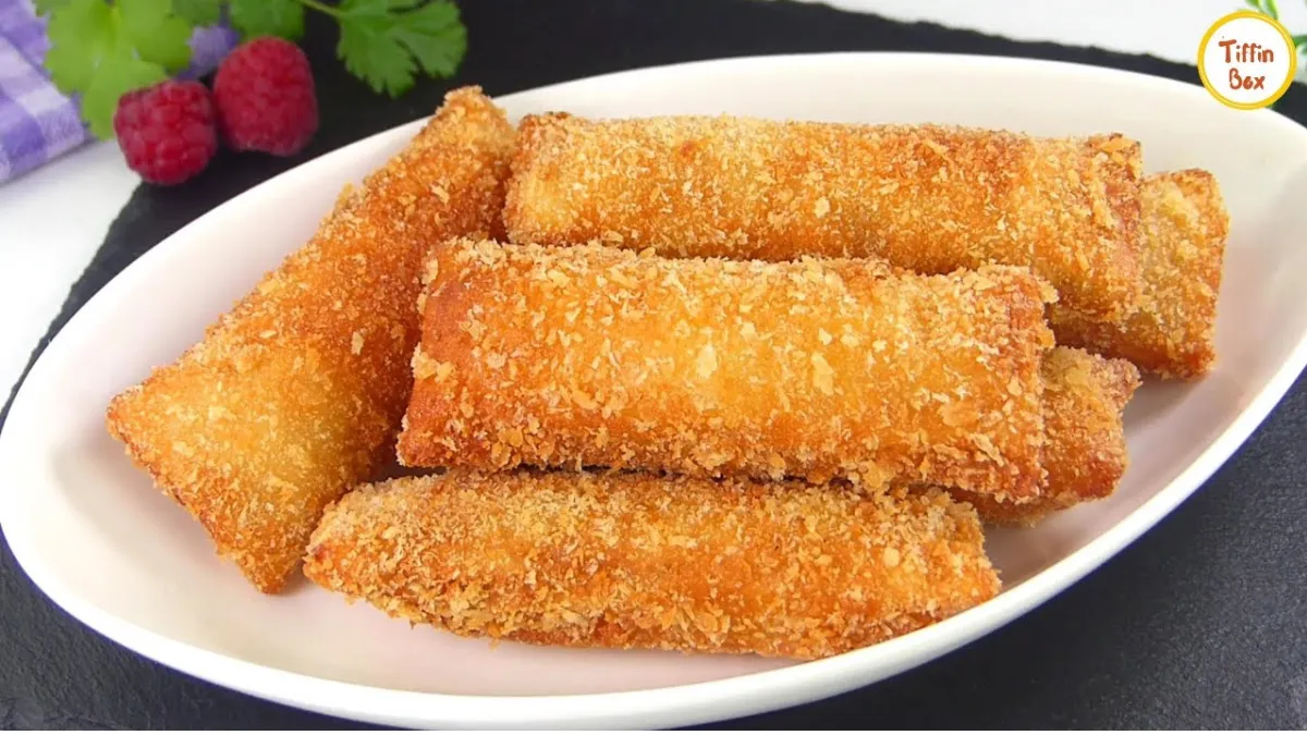 Crispy bread rolls filled with spiced mashed potatoes, arranged on a serving plate