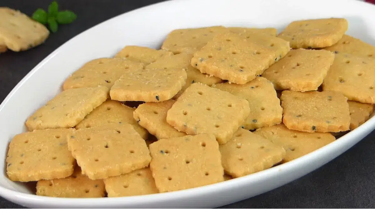 Golden eggless salted butter cookies aligned on a tray