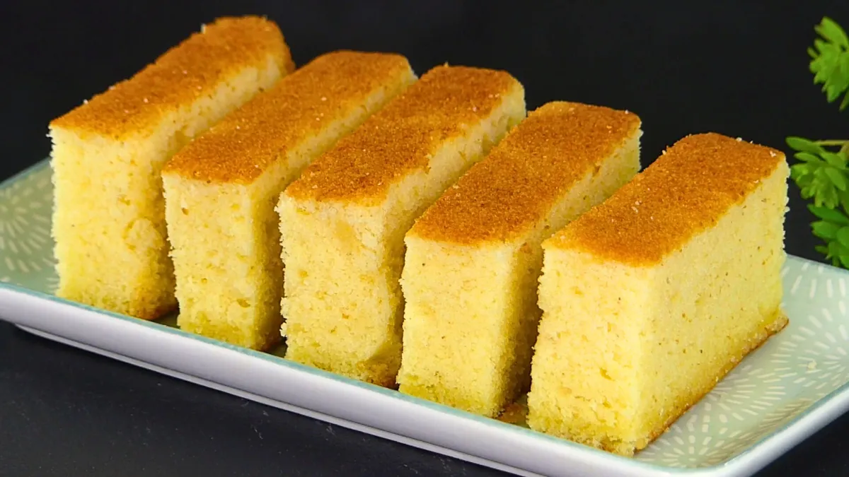 Several slices of plain sponge cake arranged on a plate